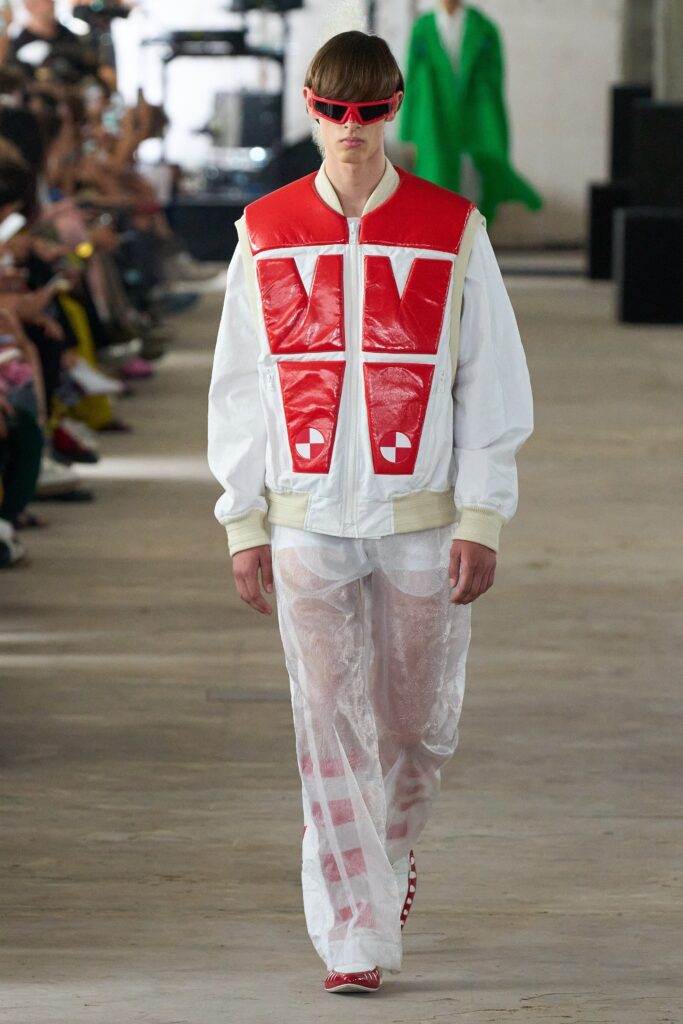 A relaxed fit color-blocked jacket with long sleeves paired with transparent pants.