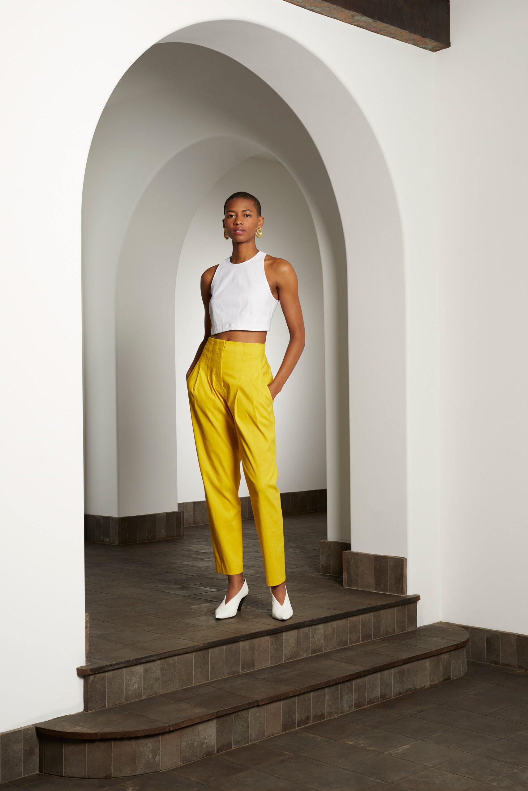 white crop-top yellow tailored pants