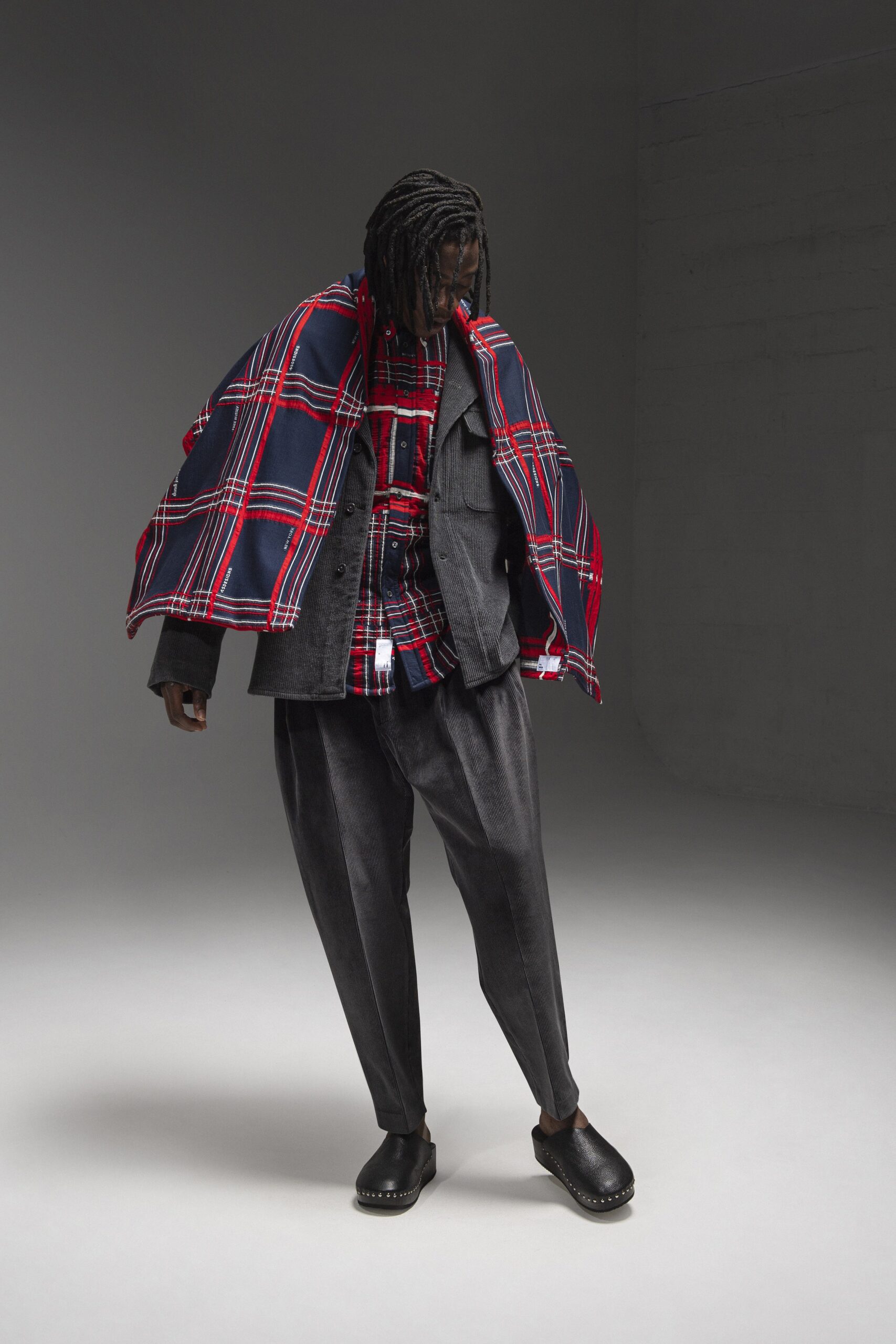 relaxed black jacket with checked shirt