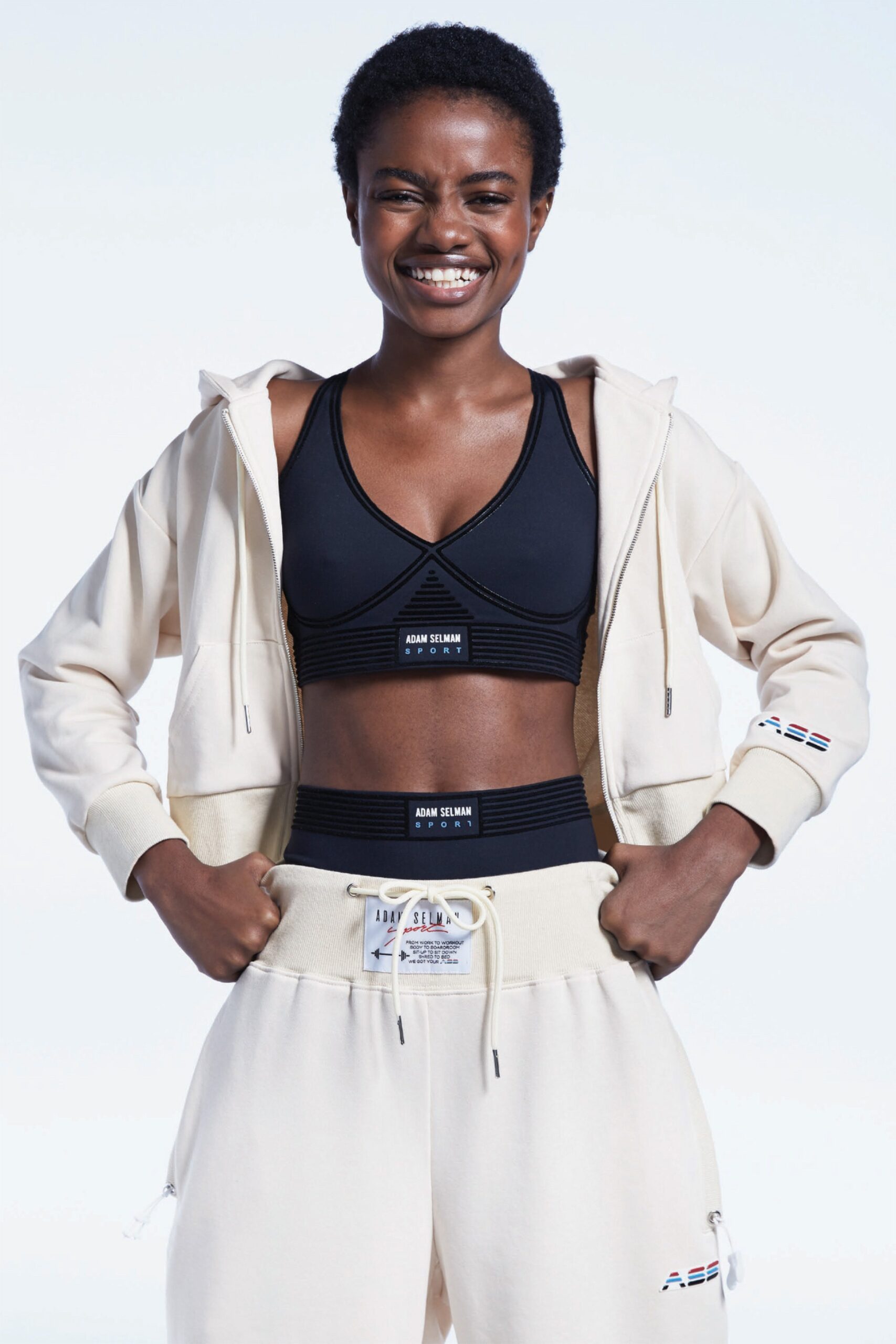 beige hoodie black bra beige pants