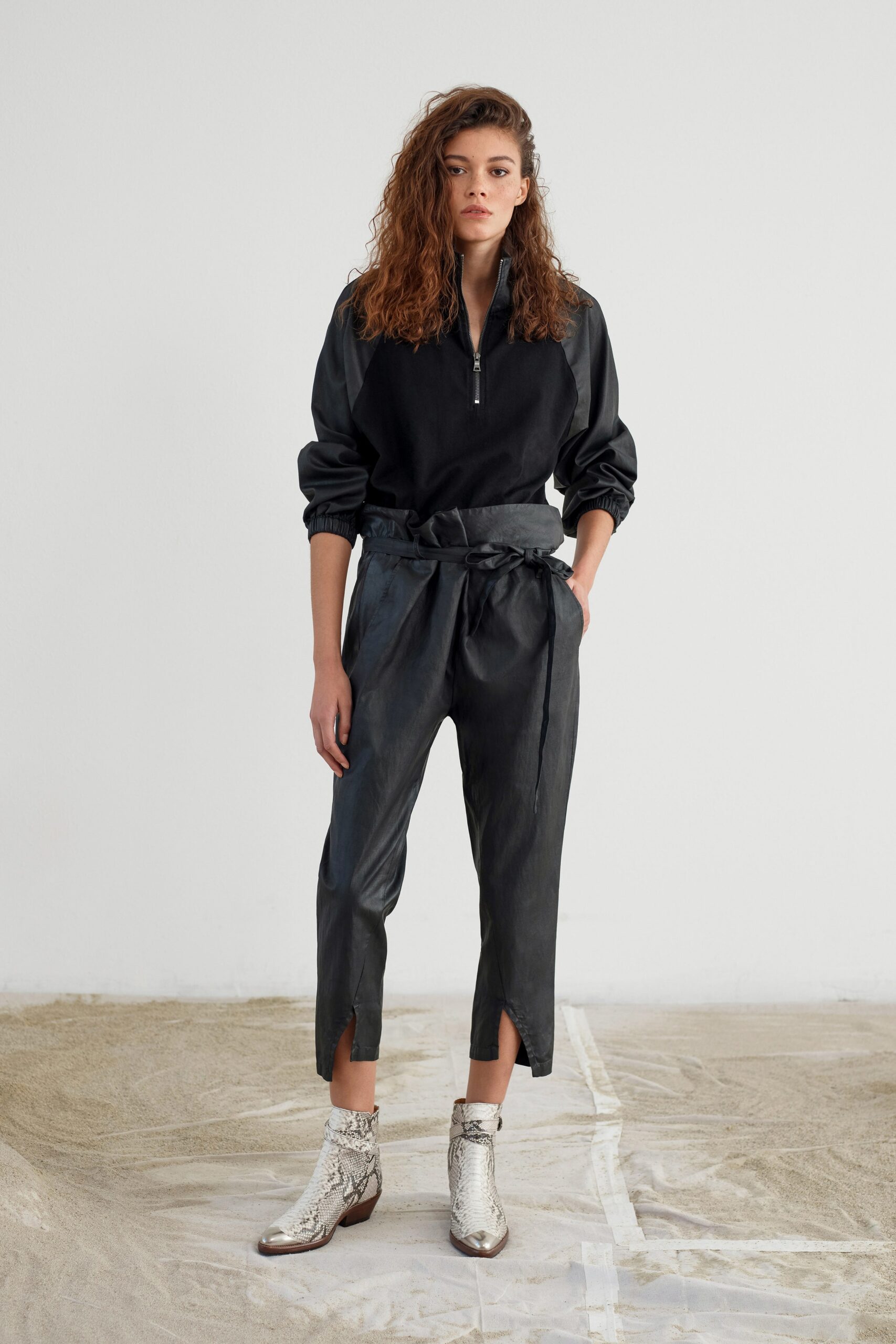 black relaxed top with leather pants