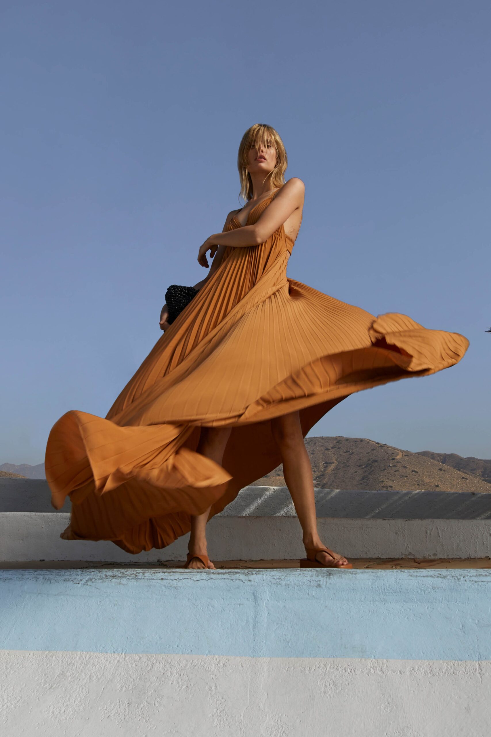 orange pleated maxi dress
