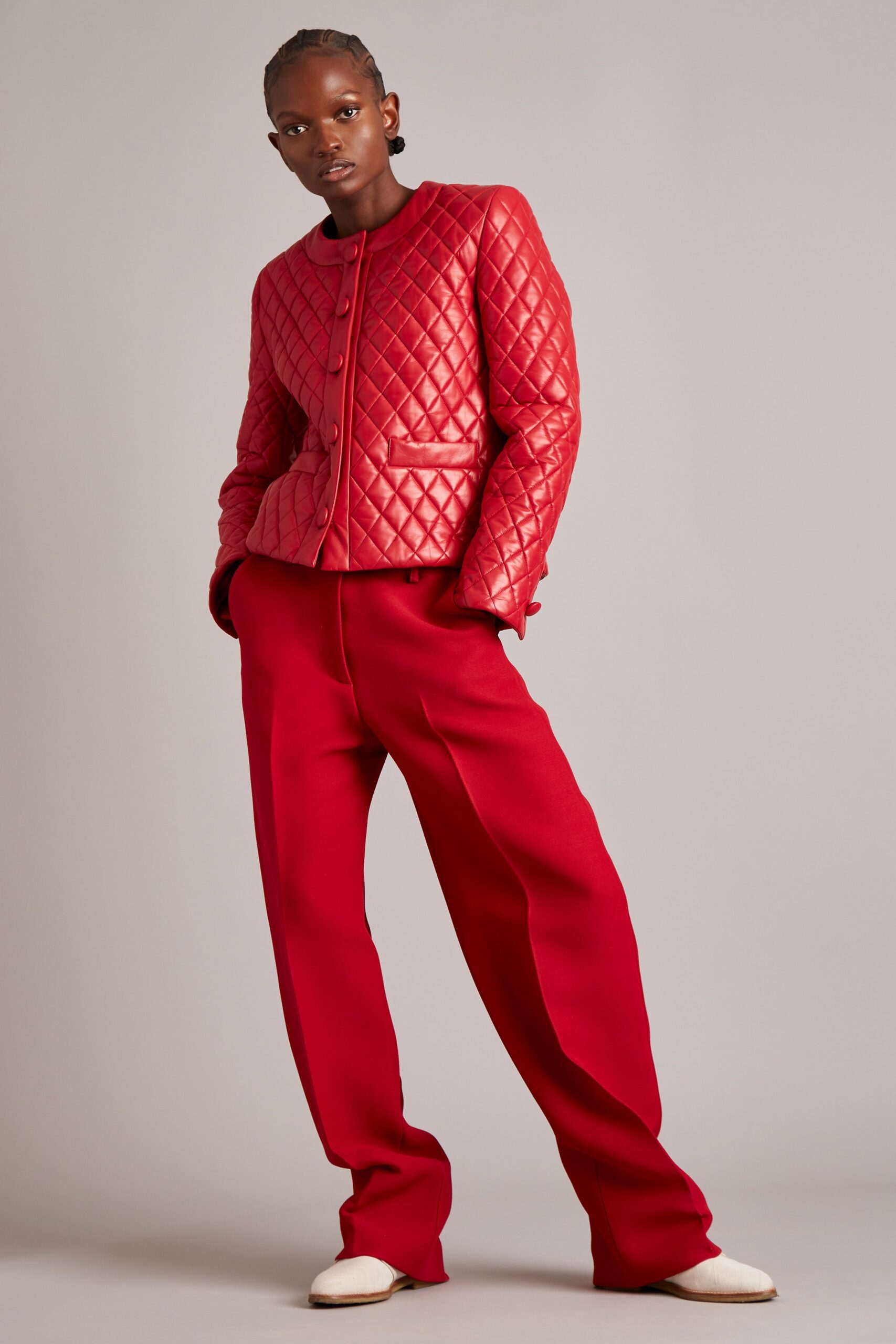red quilted leather jacket and wide-leg pants