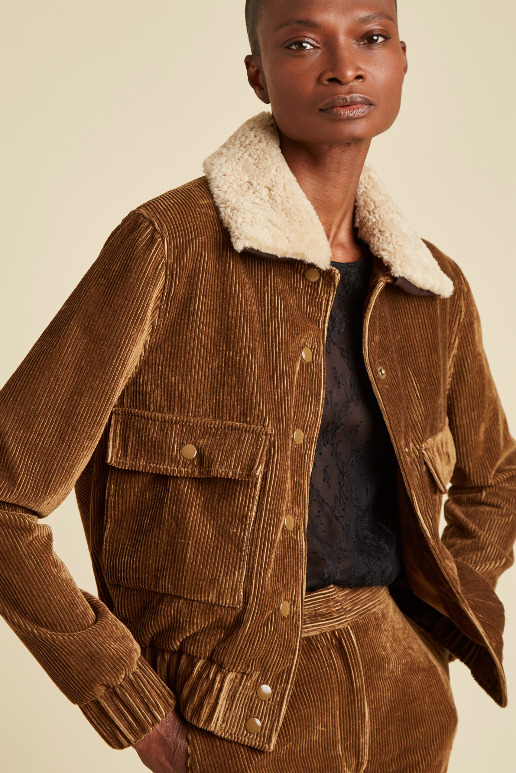 brown corduroy jacket with black lace top