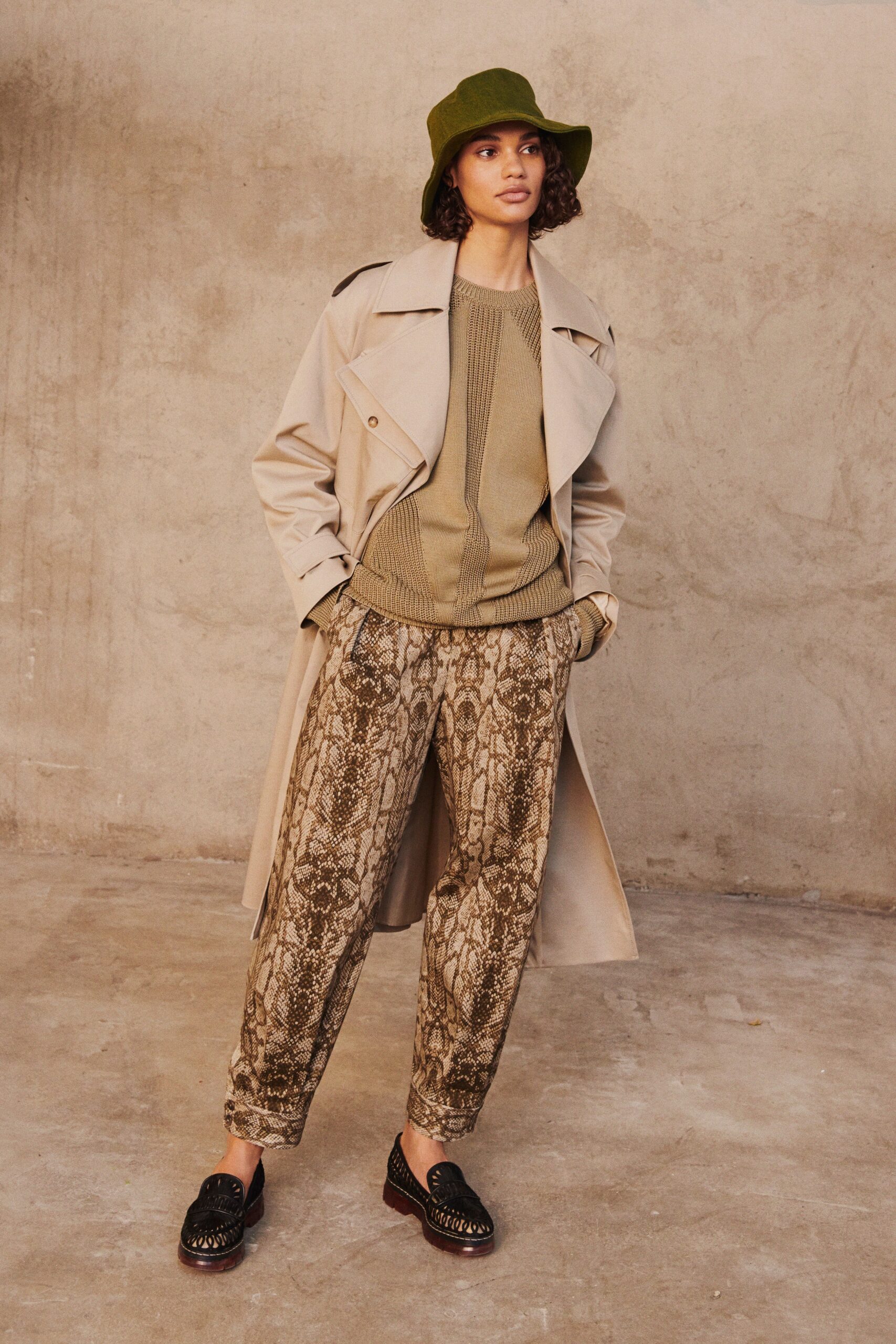 beige trench coat with green sweater