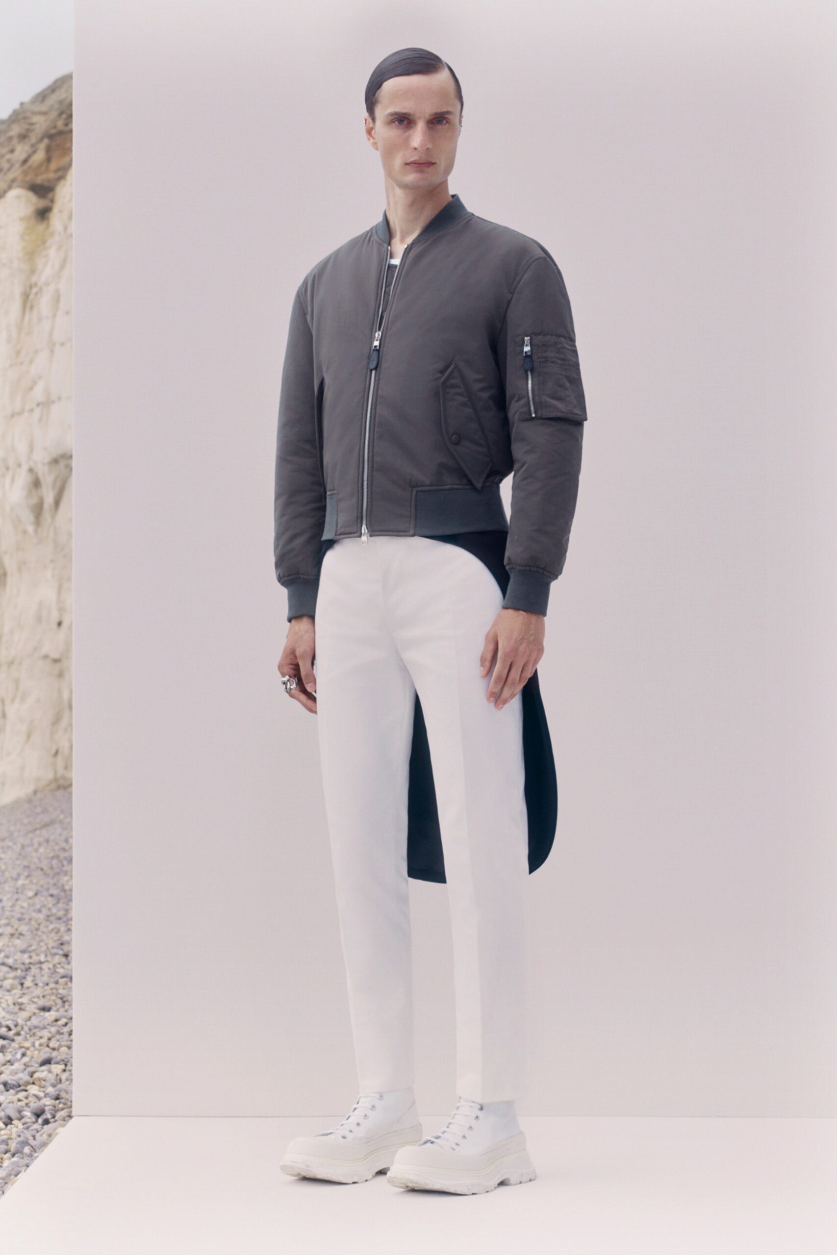 gray fitted jacket with white pants