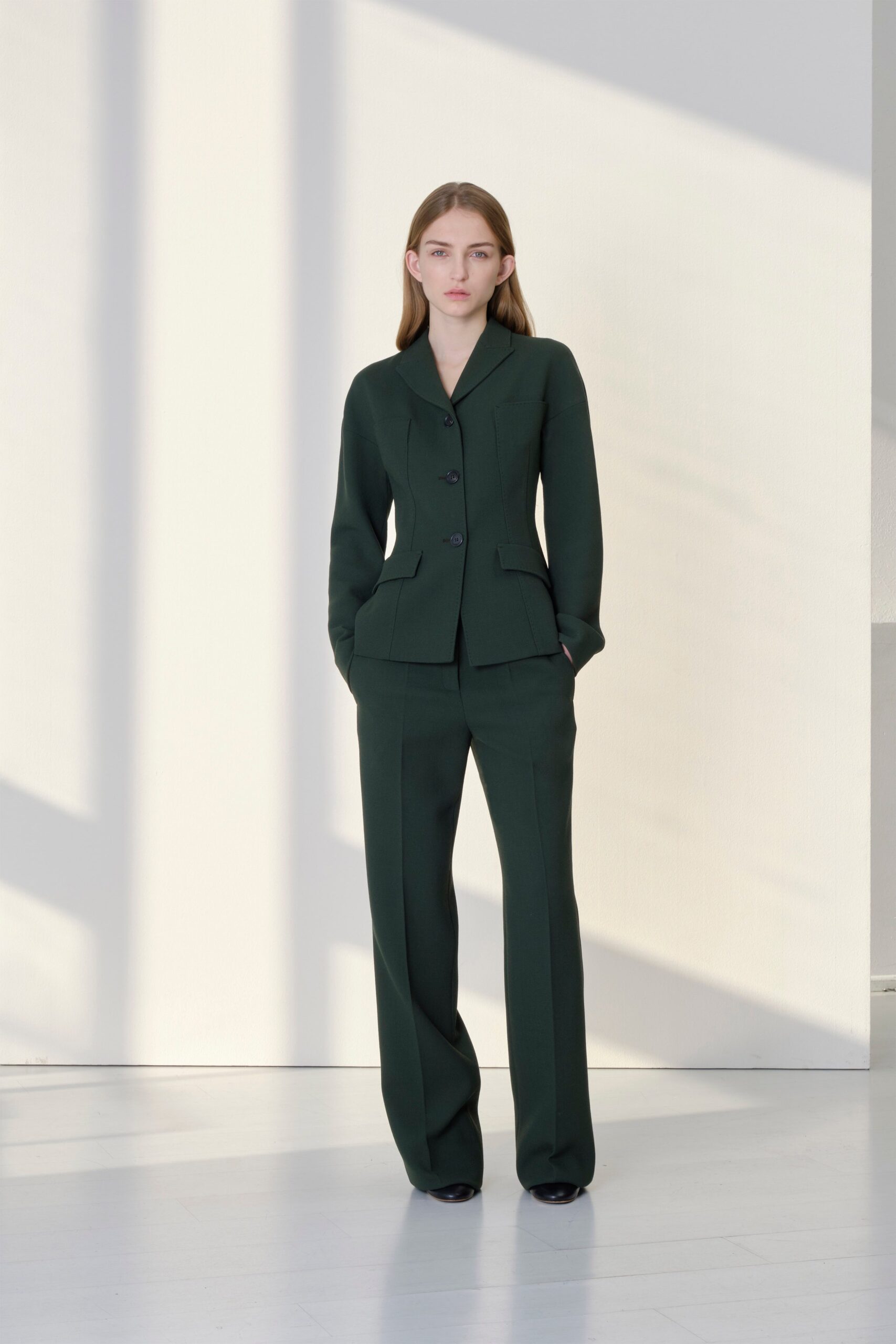 green tailored wool suit