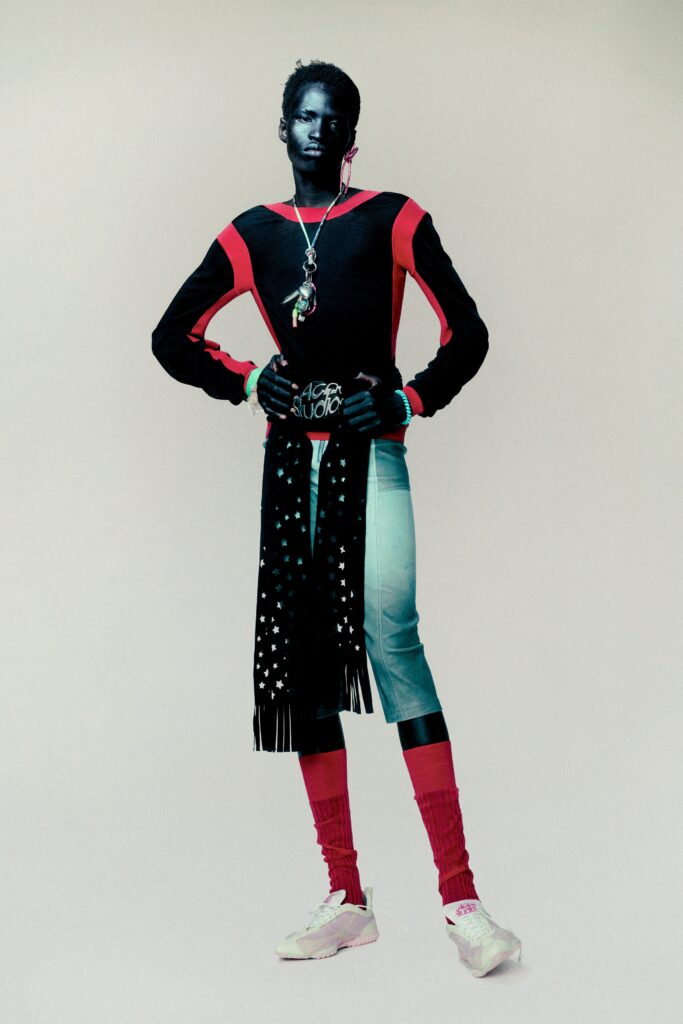 A fitted long-sleeve color-blocked top paired with fitted pants in a unique style.