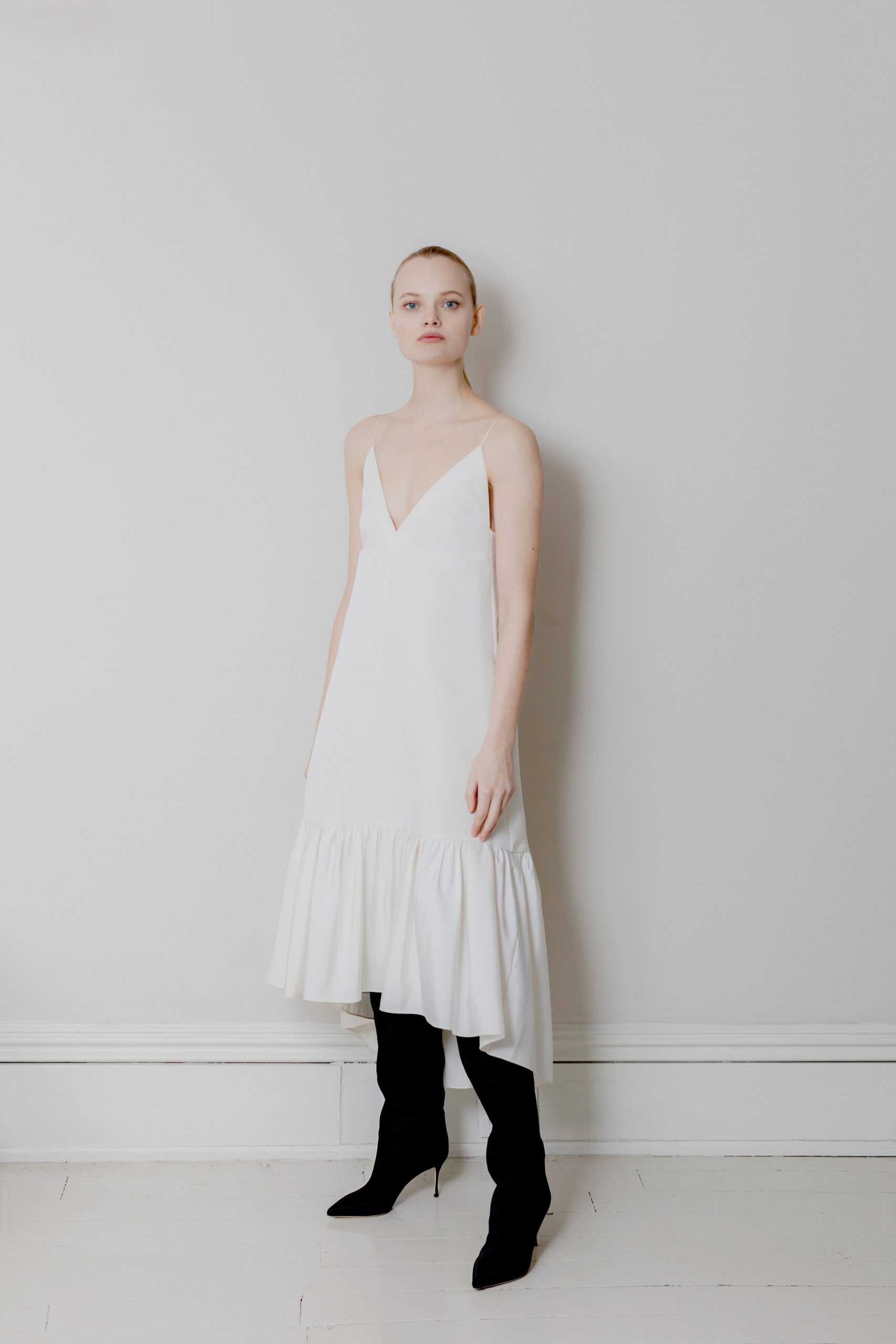 white tiered midi dress with black boots