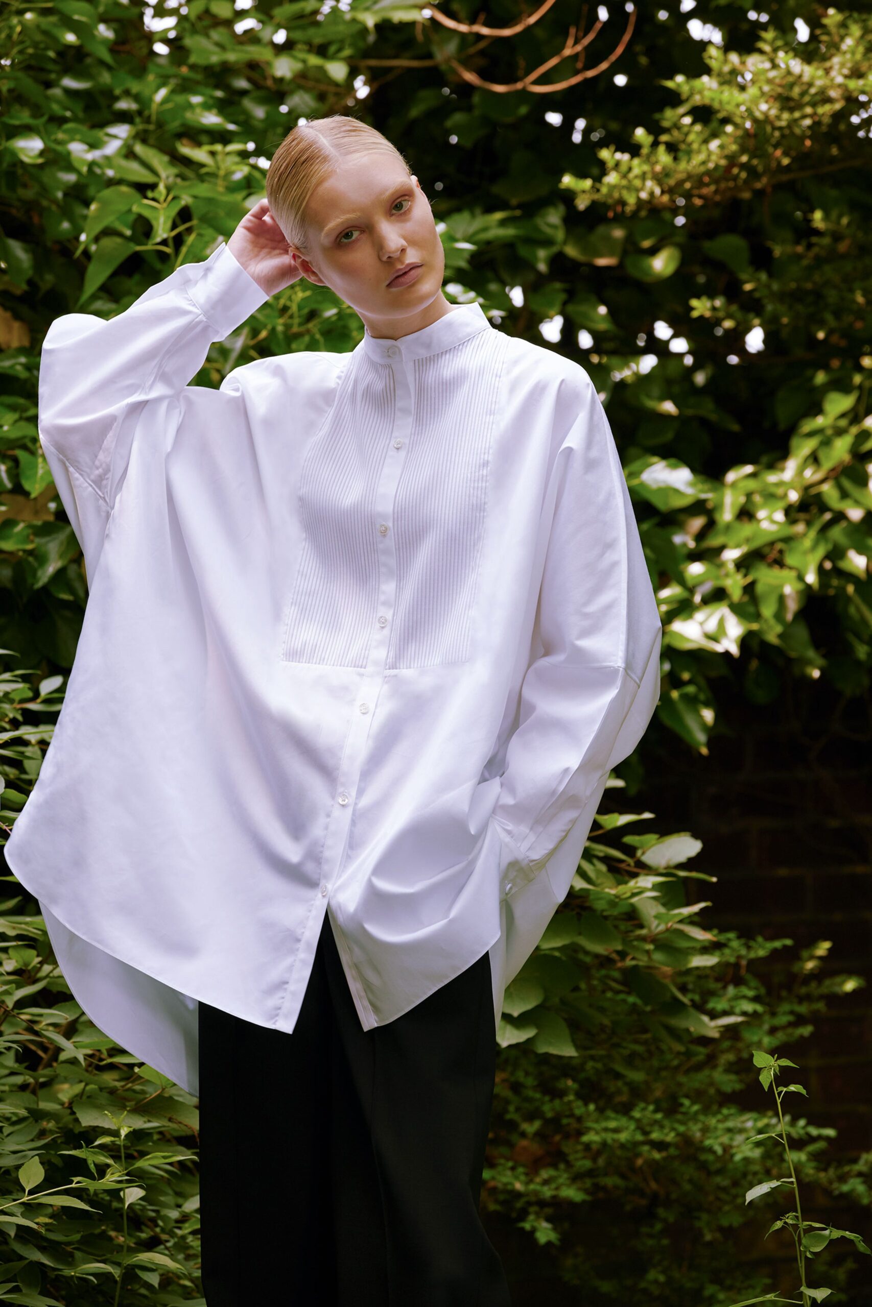 white cotton long-sleeve collared oversized pleated shirt