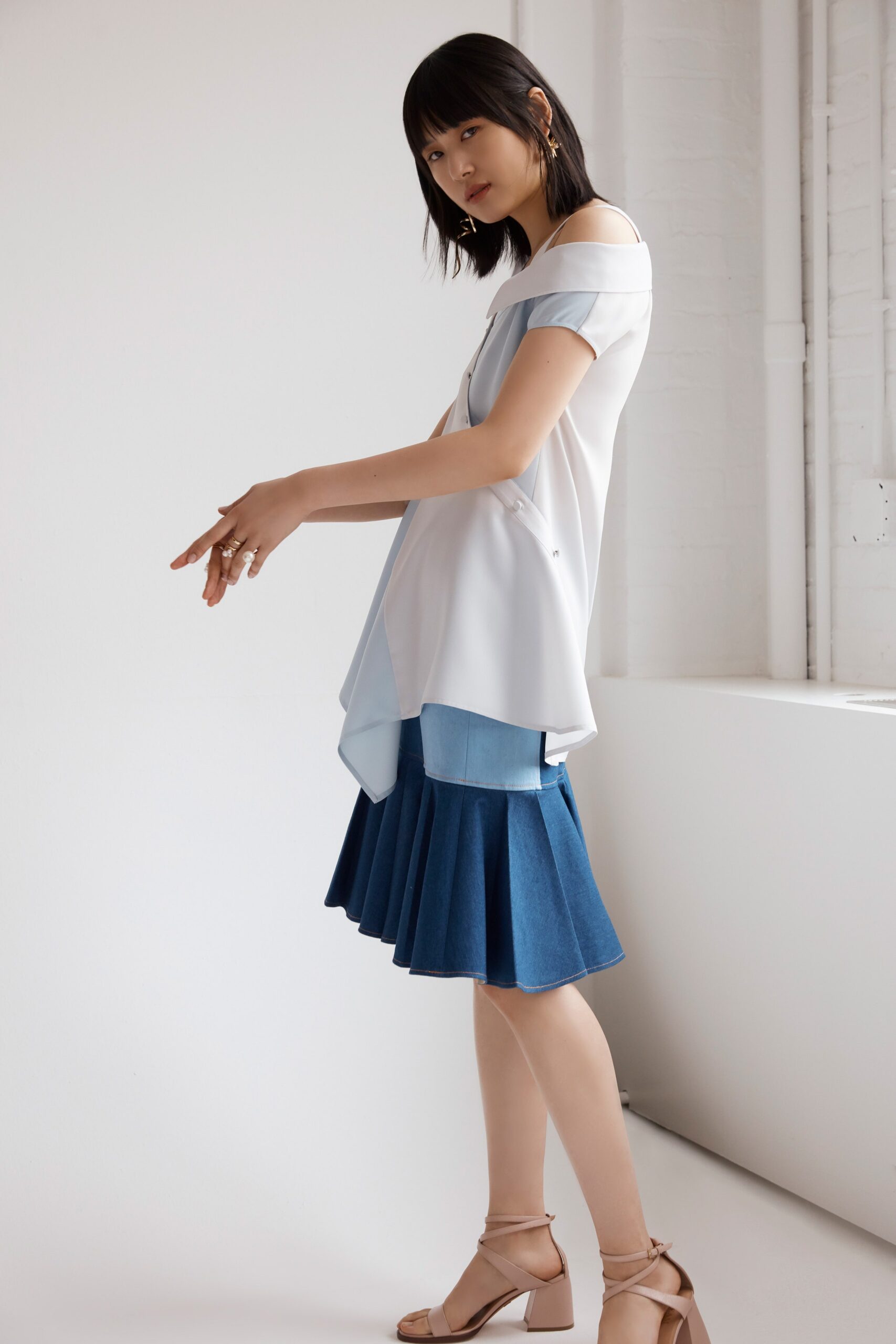 white blue off-shoulder top with pleated skirt