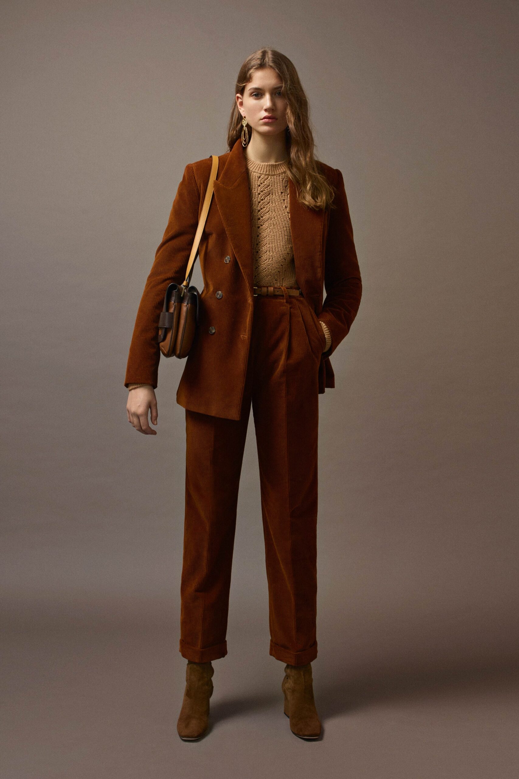 brown tailored suit with knit top