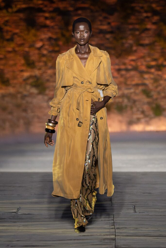 A relaxed brown silk coat dress with long sleeves and a belted design.