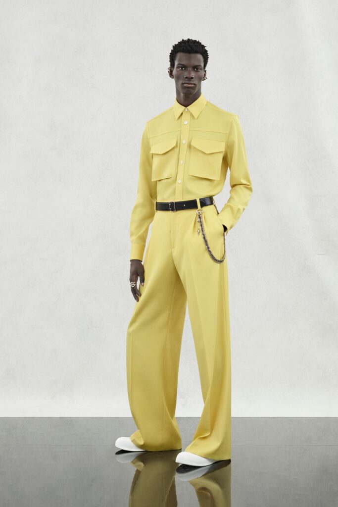 A relaxed yellow cotton long-sleeve shirt with wide-leg pants, featuring a collared design.