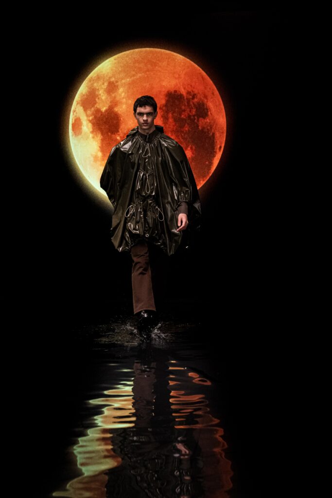 green vinyl poncho with brown pants