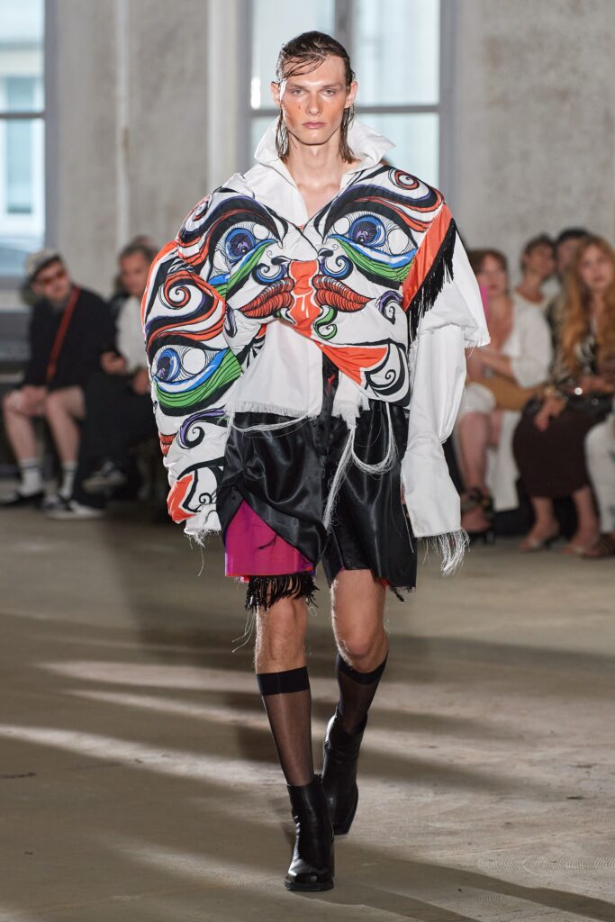 white embroidered shirt with black skirt