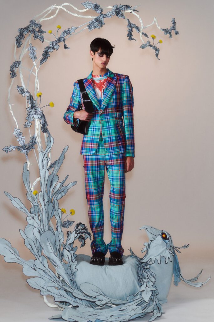 A tailored suit featuring a checked pattern in blue, green, and red with a collared long-sleeve shirt.