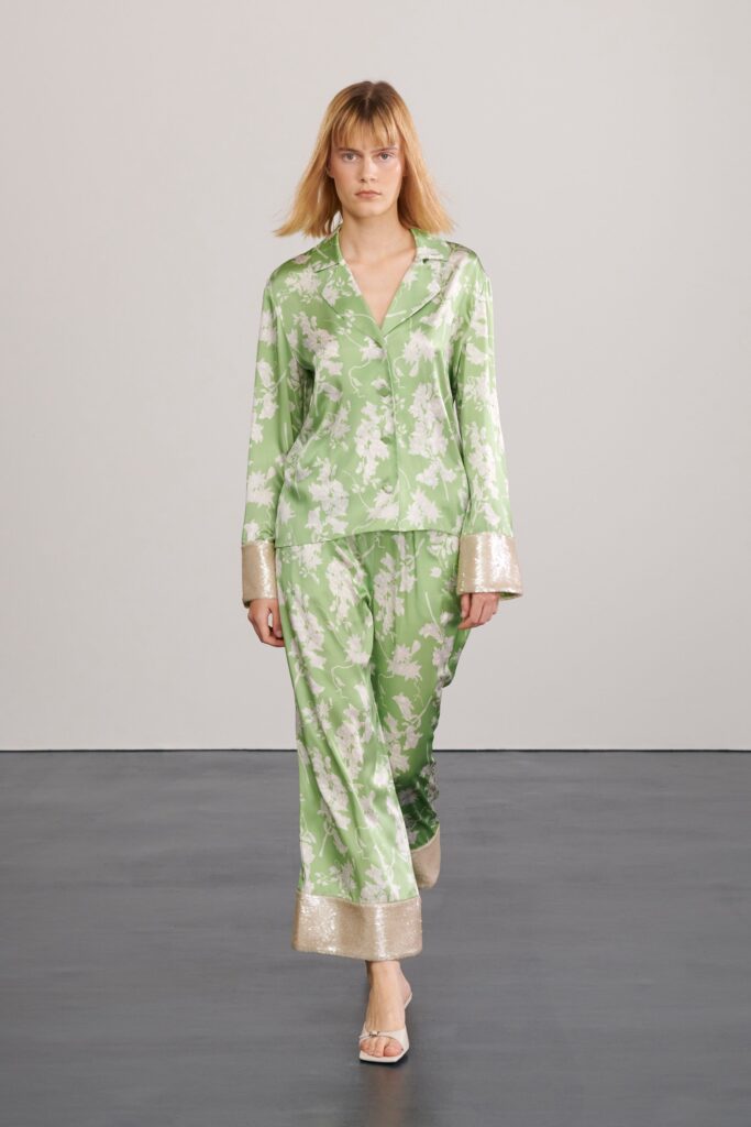 A relaxed fit green floral silk shirt with long sleeves paired with matching pants.