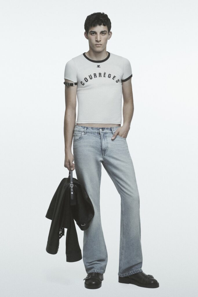 A fitted white t-shirt with a printed design paired with flared blue jeans.