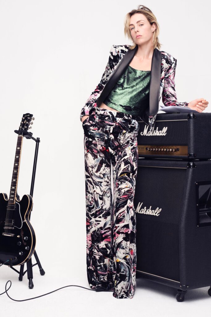 A fitted multicolor silk blazer with long sleeves and printed pants, perfect for a stylish look.