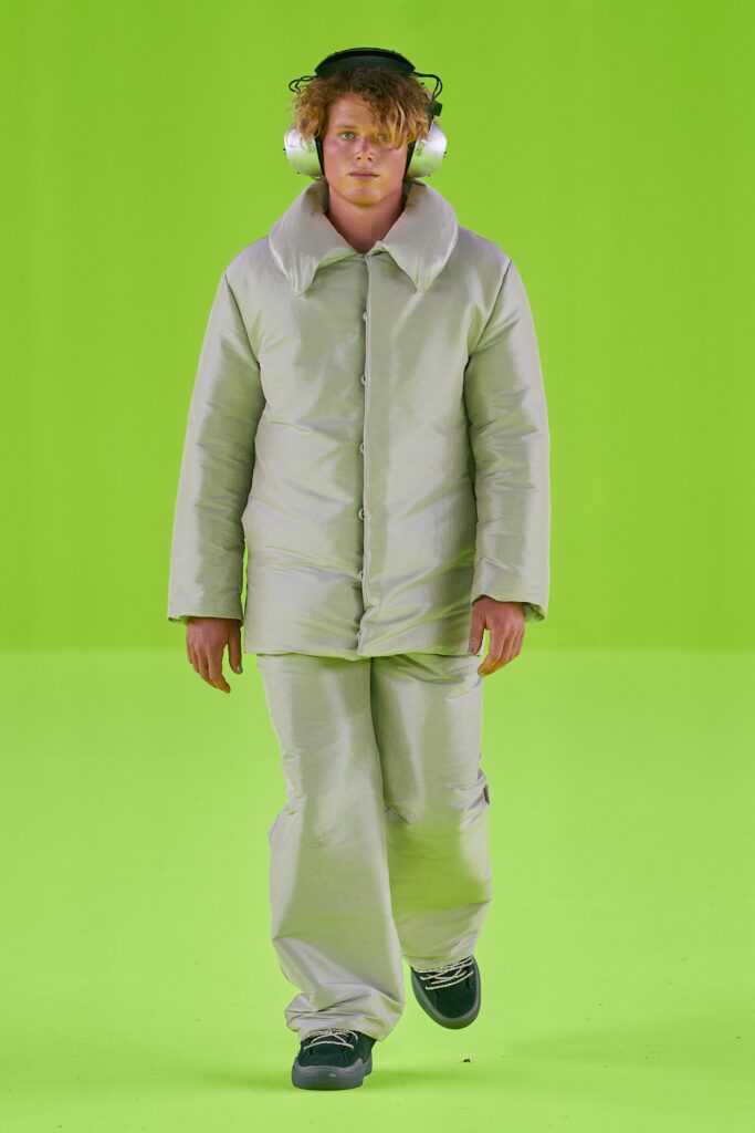 A relaxed beige jacket with a collared neckline paired with matching pants.