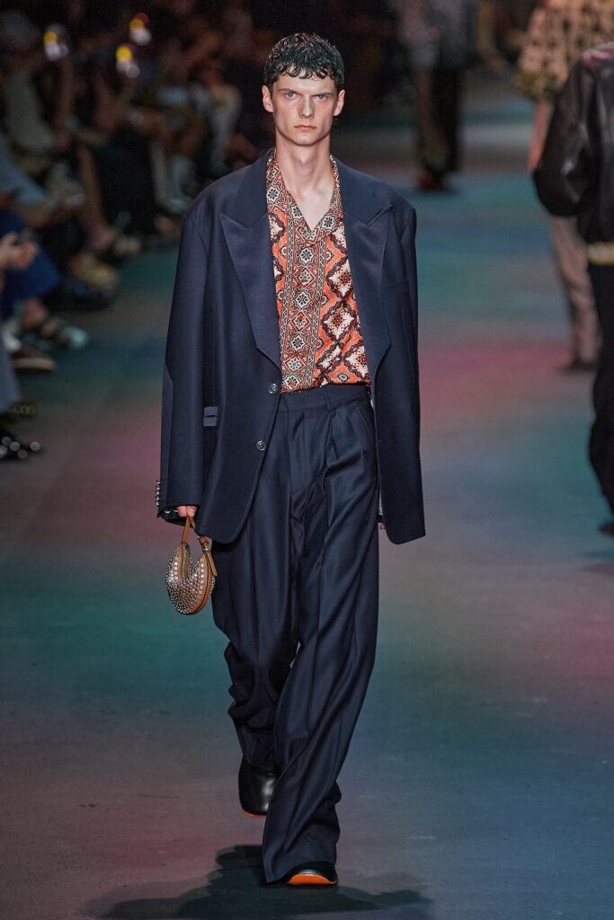 A relaxed navy suit featuring a long-sleeve collared shirt with a printed design.