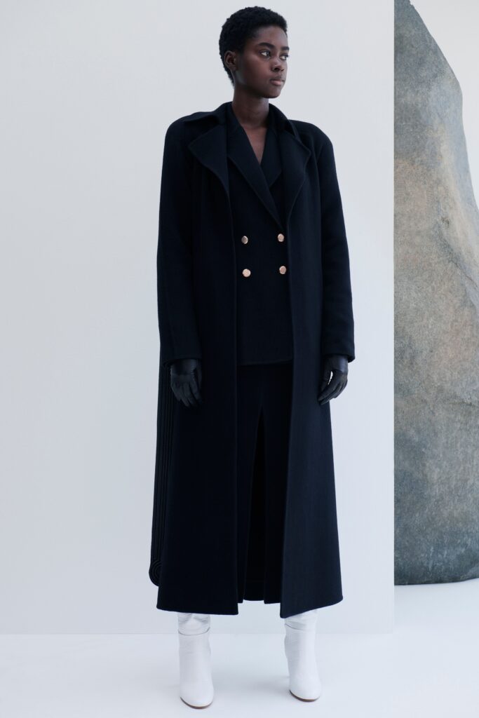 black wool coat with white boots