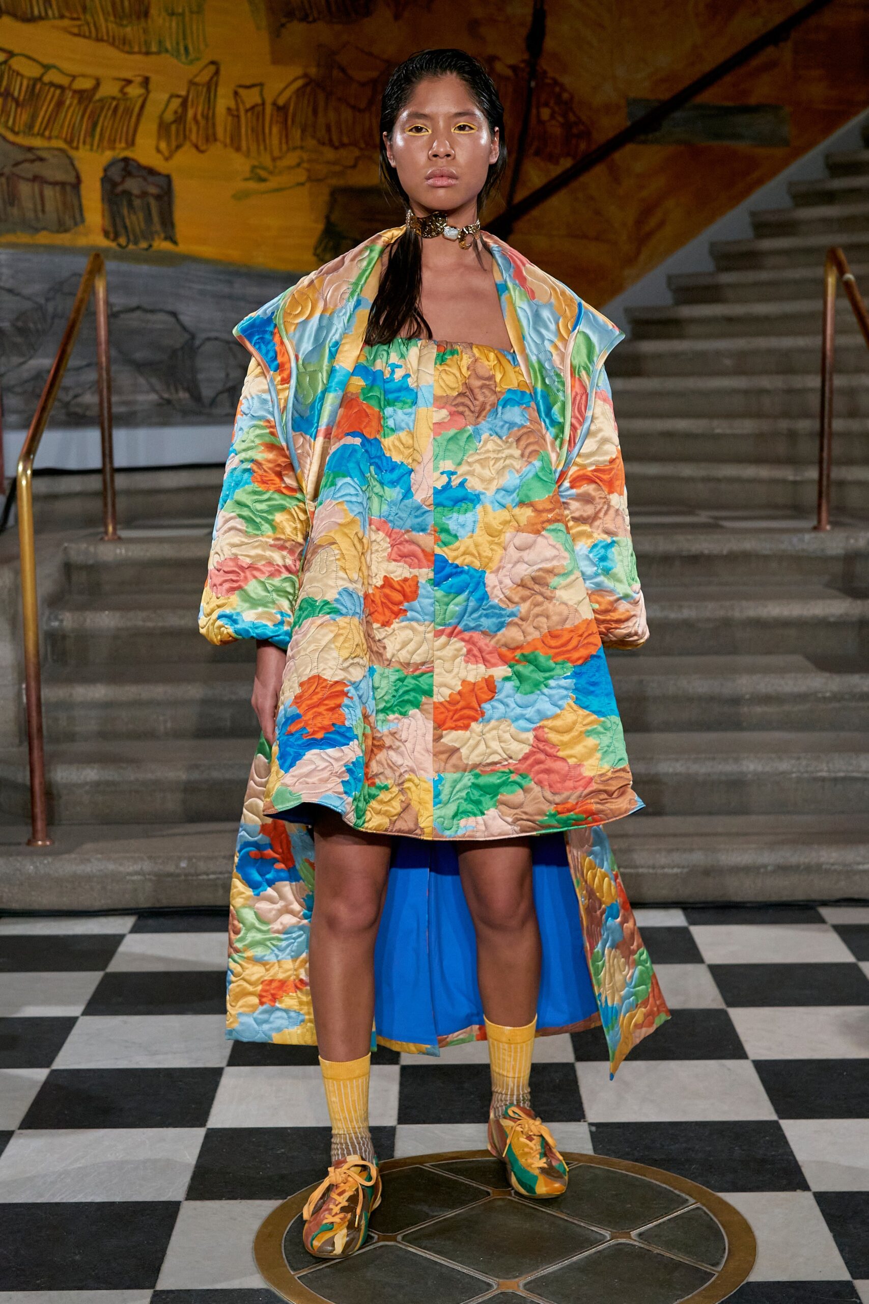 A relaxed multicolor dress with a coat overlay, featuring a collared design and layered detail.