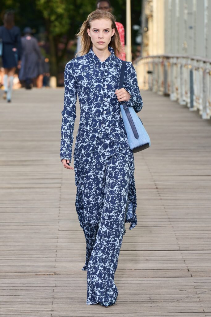 A relaxed blue floral long-sleeve dress with a collared neckline.