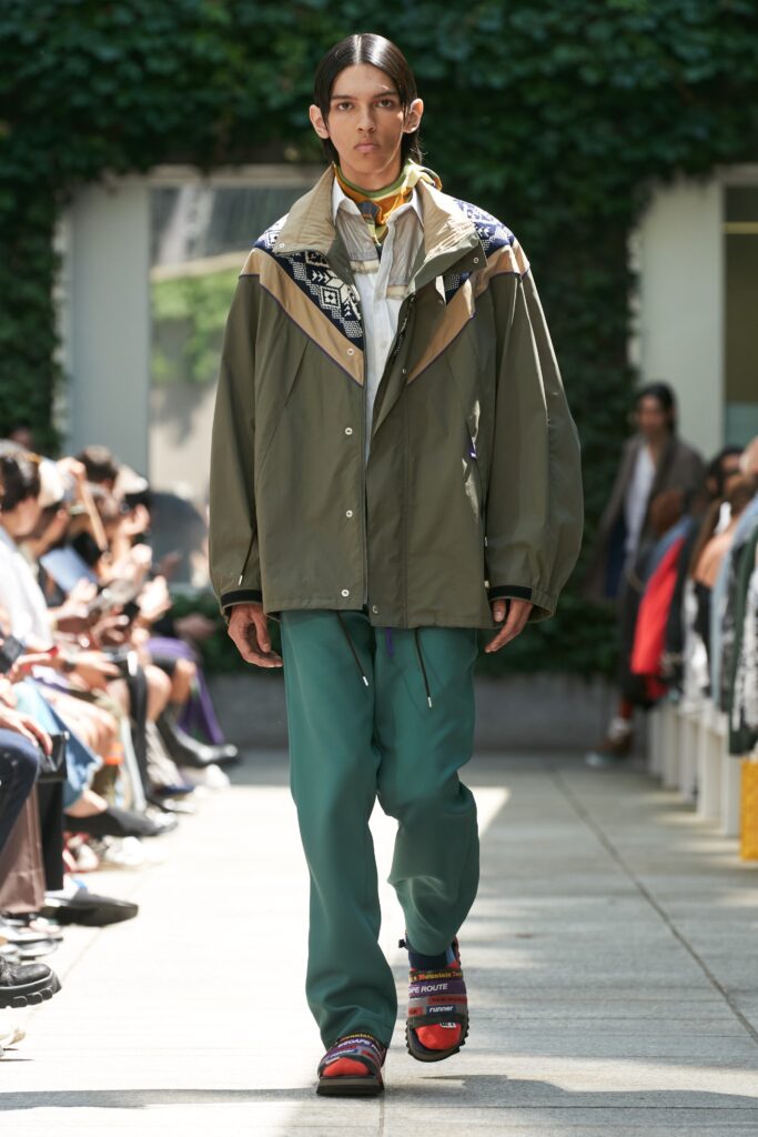 A relaxed green cotton jacket with a collared neckline paired with matching pants.