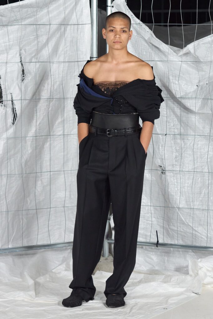 black off-shoulder top with tailored pants