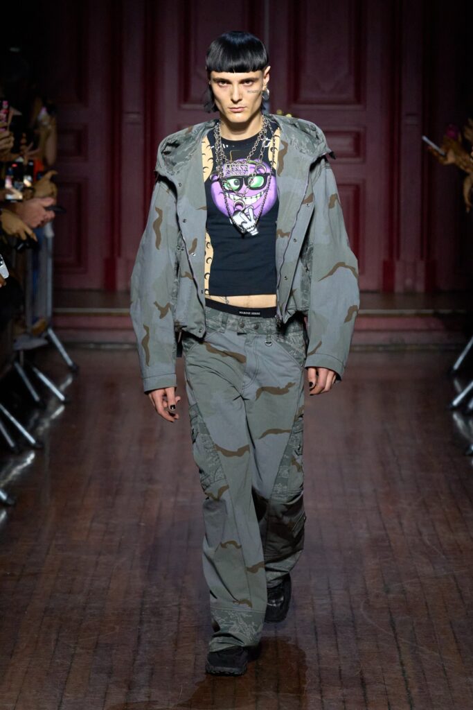 A relaxed fit gray camouflage jacket paired with matching pants for a trendy streetwear look.