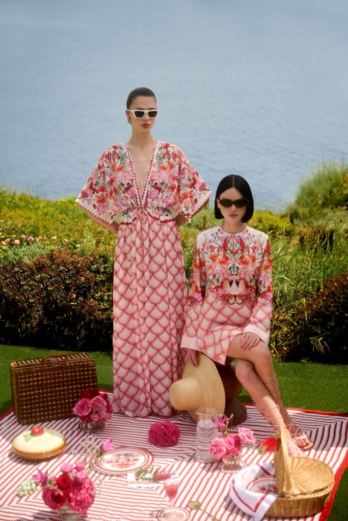 A relaxed pink long-sleeve dress with a V-neckline and flared silhouette, perfect for summer outings.