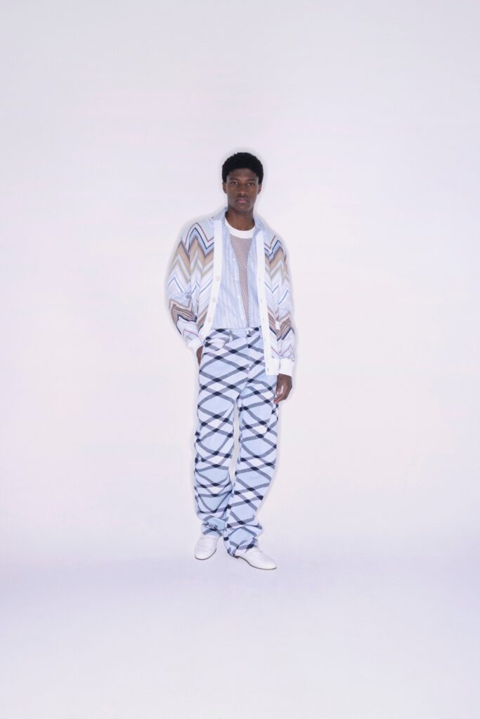 A relaxed fit long-sleeve collared shirt paired with wide-leg pants featuring a striped pattern.