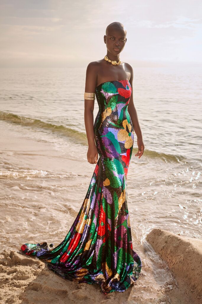 A fitted multicolor sequin strapless gown with a flared silhouette, perfect for evening wear.