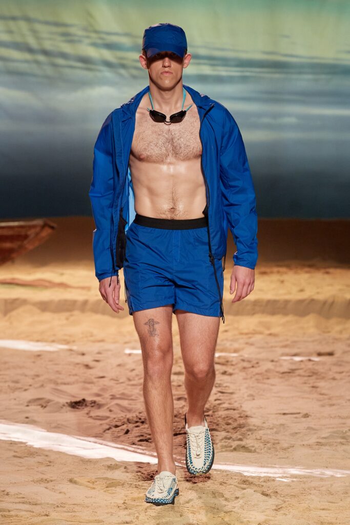 A relaxed blue cotton jacket with long sleeves paired with matching shorts.