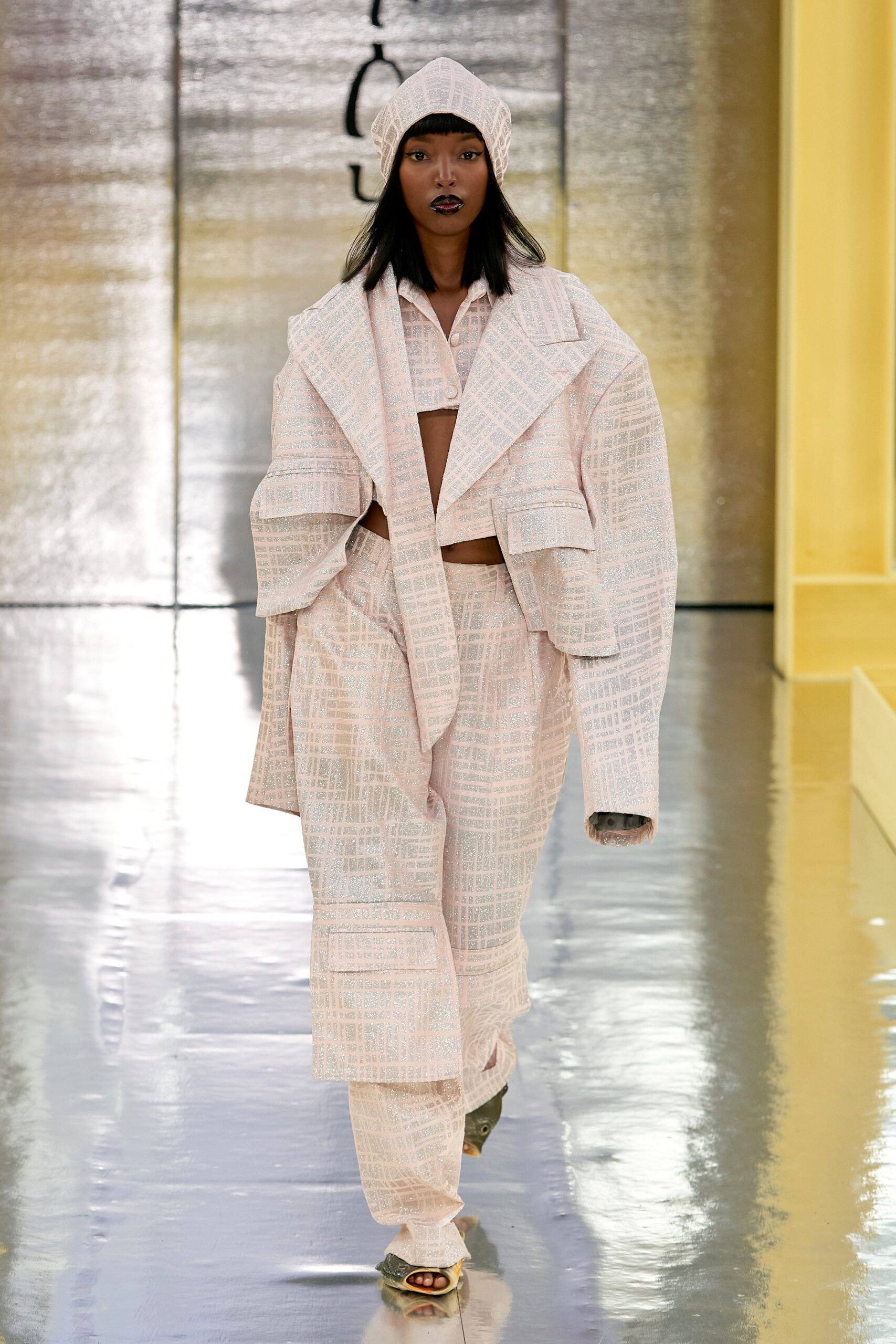 An oversized pink cotton jacket with long sleeves and collared design, paired with matching pants.