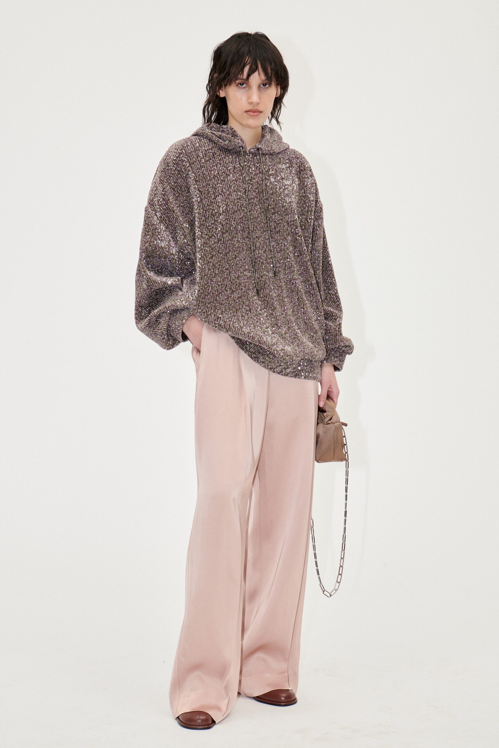 oversized purple hoodie and beige pants