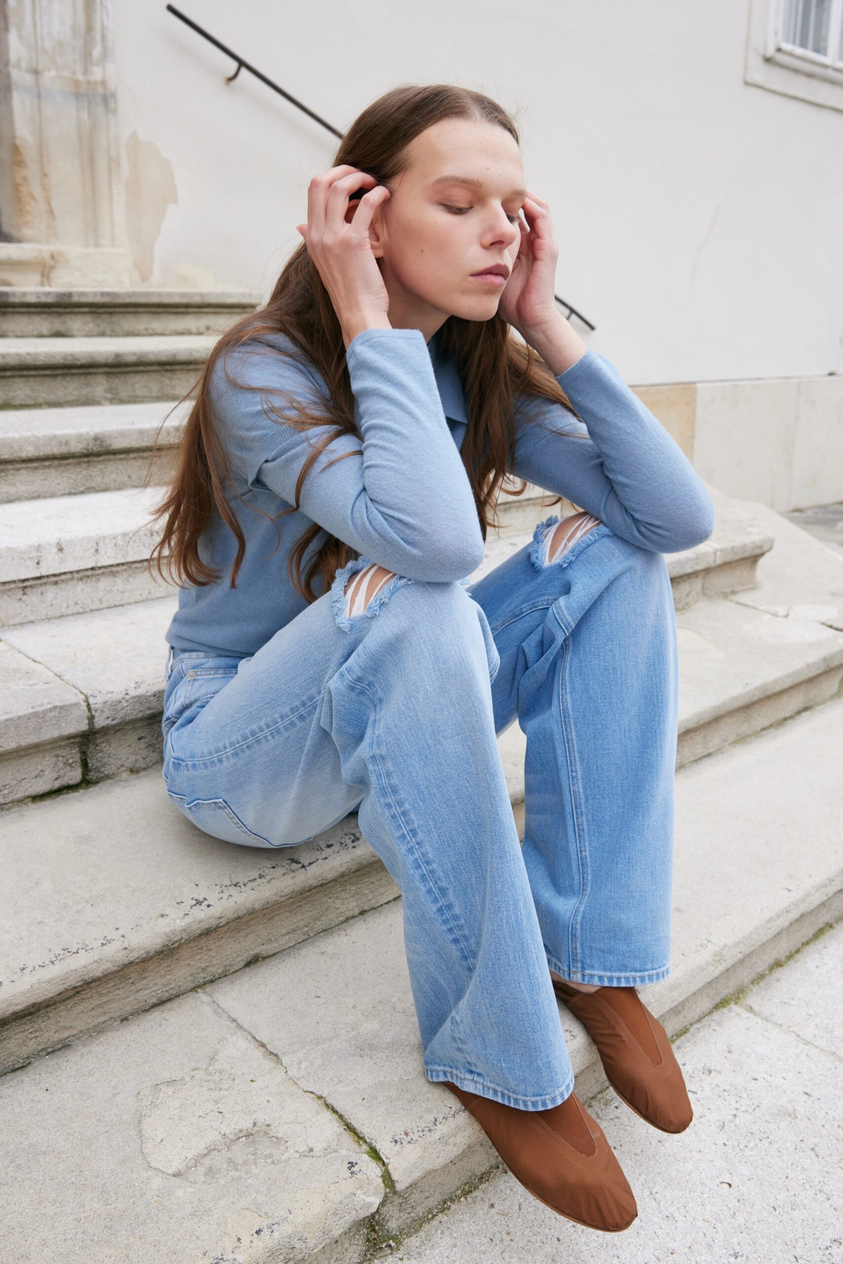 blue fitted top with relaxed jeans