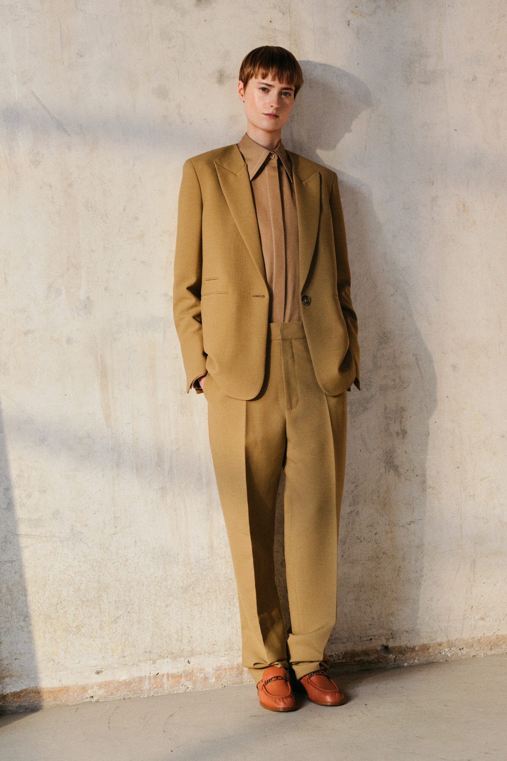 brown tailored suit with beige shirt