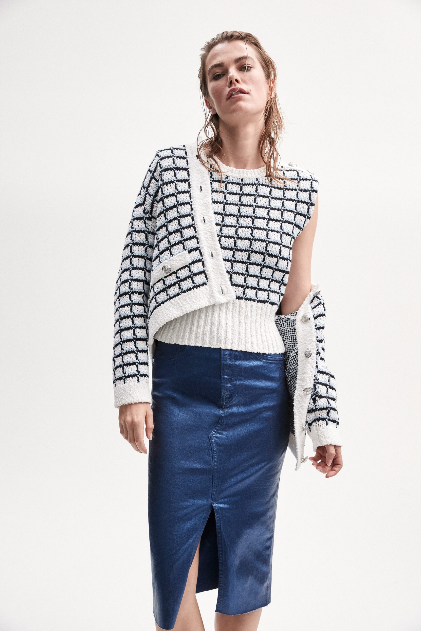 fitted white and black top with blue skirt