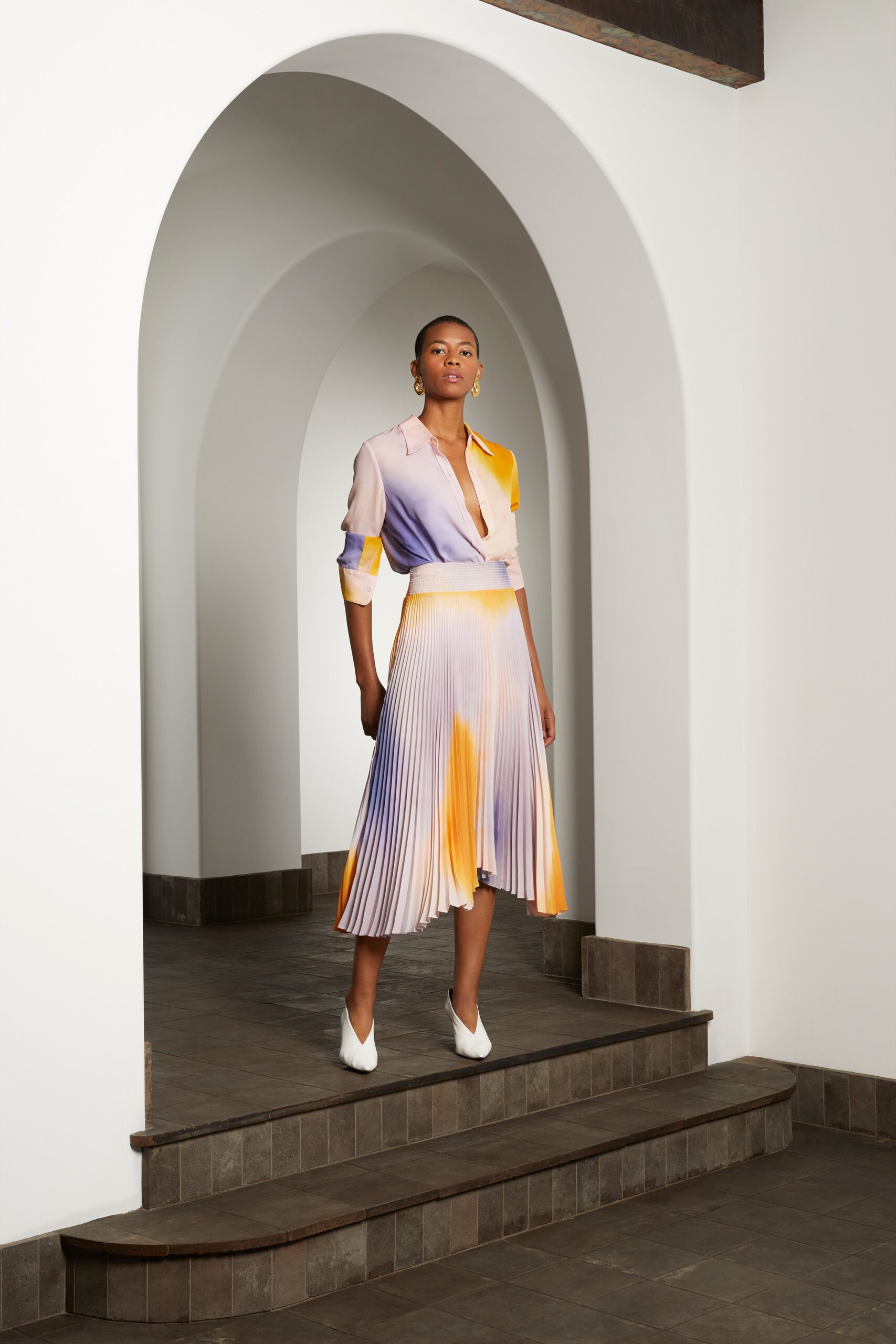 purple and orange pleated outfit