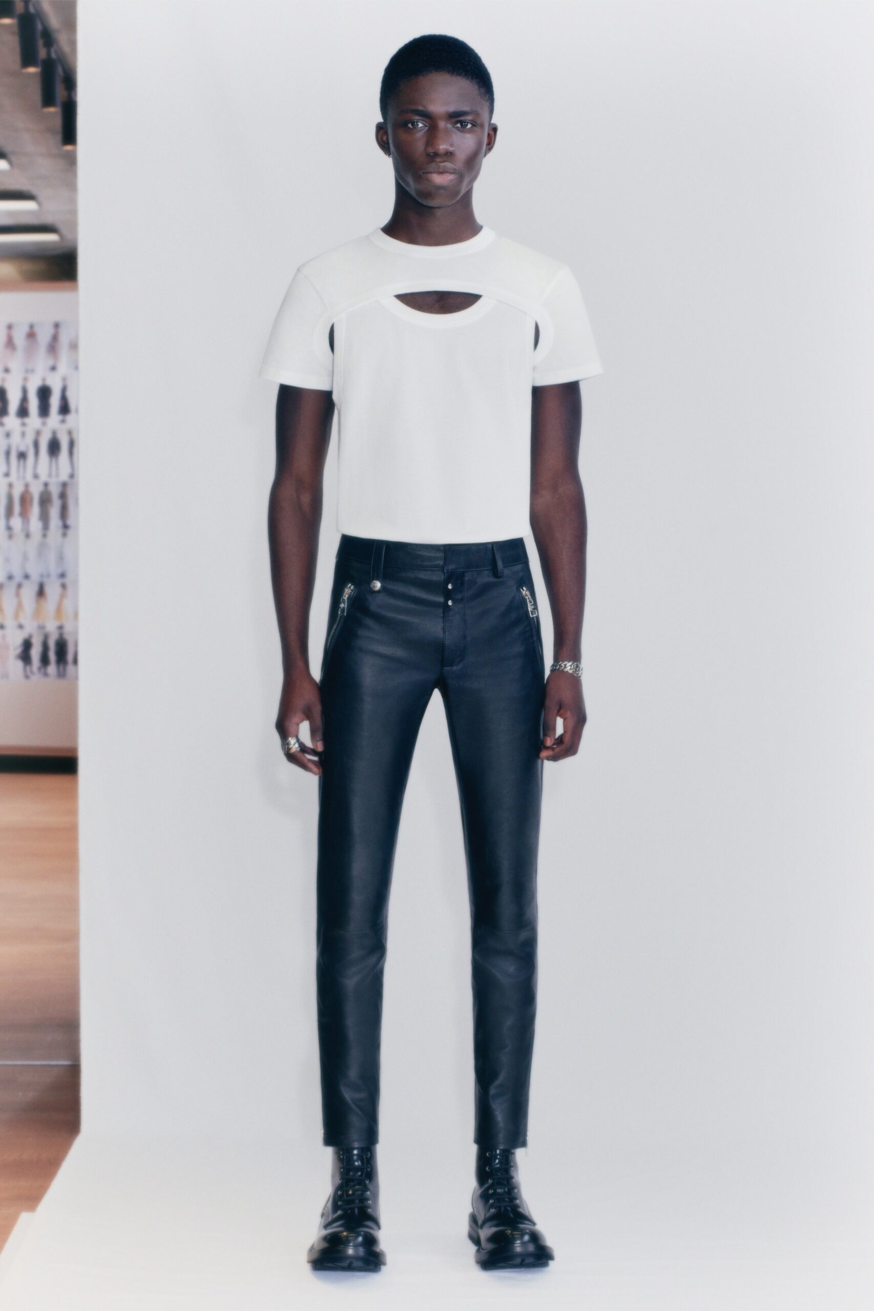 white cutout t-shirt and black leather pants