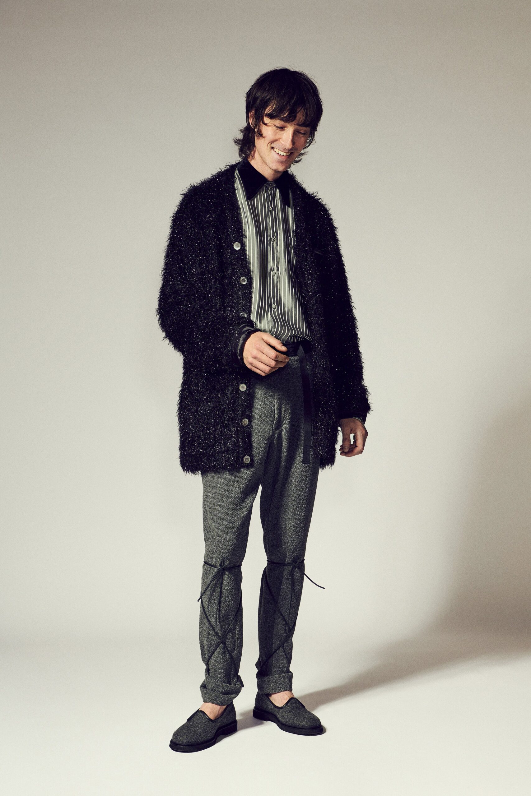 black wool coat with striped shirt