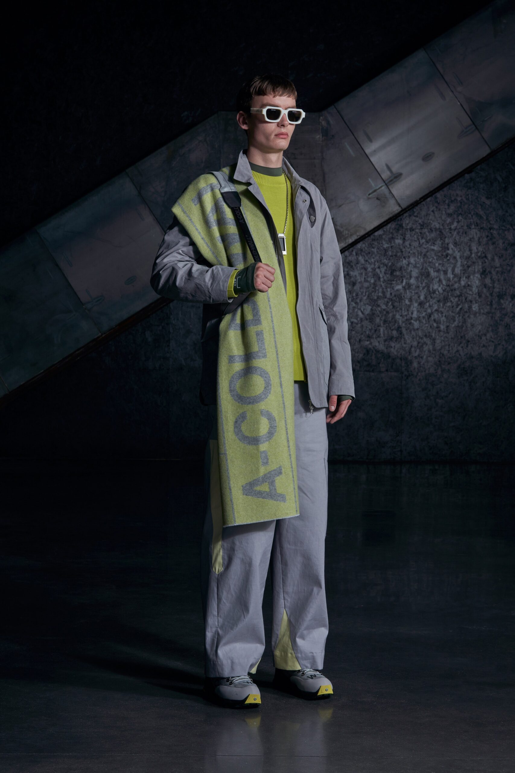 A relaxed gray jacket with long sleeves and matching pants, featuring a zippered detail.