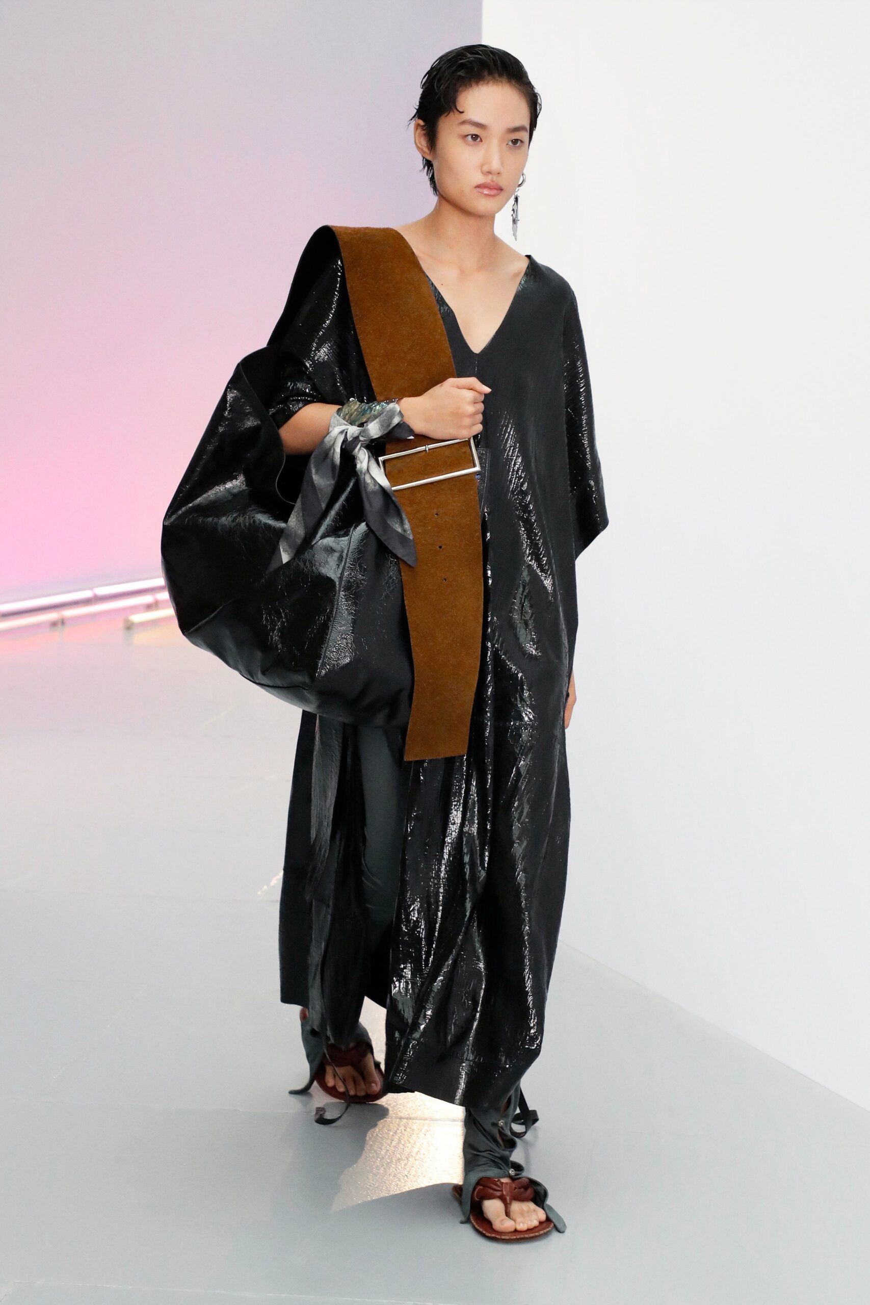 black vinyl relaxed dress with brown bag