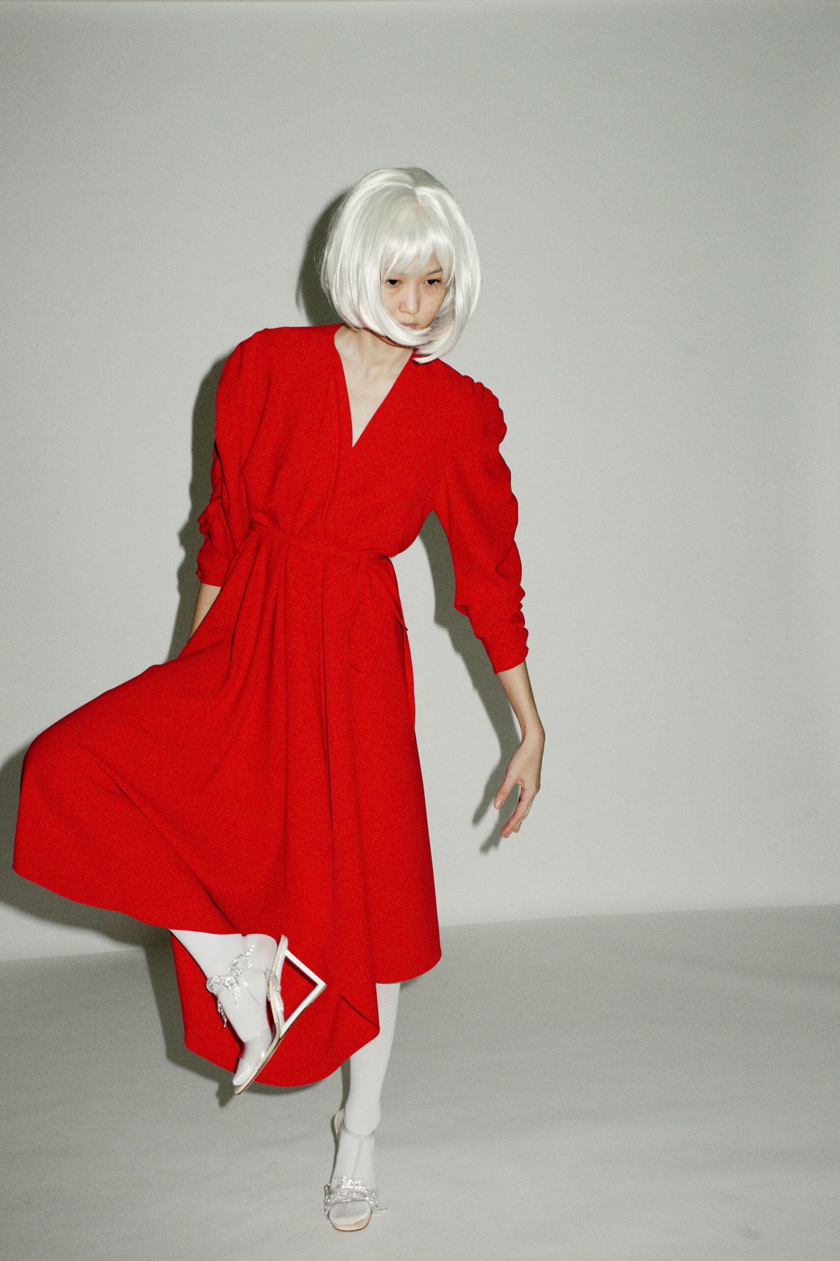 red belted midi dress with white shoes