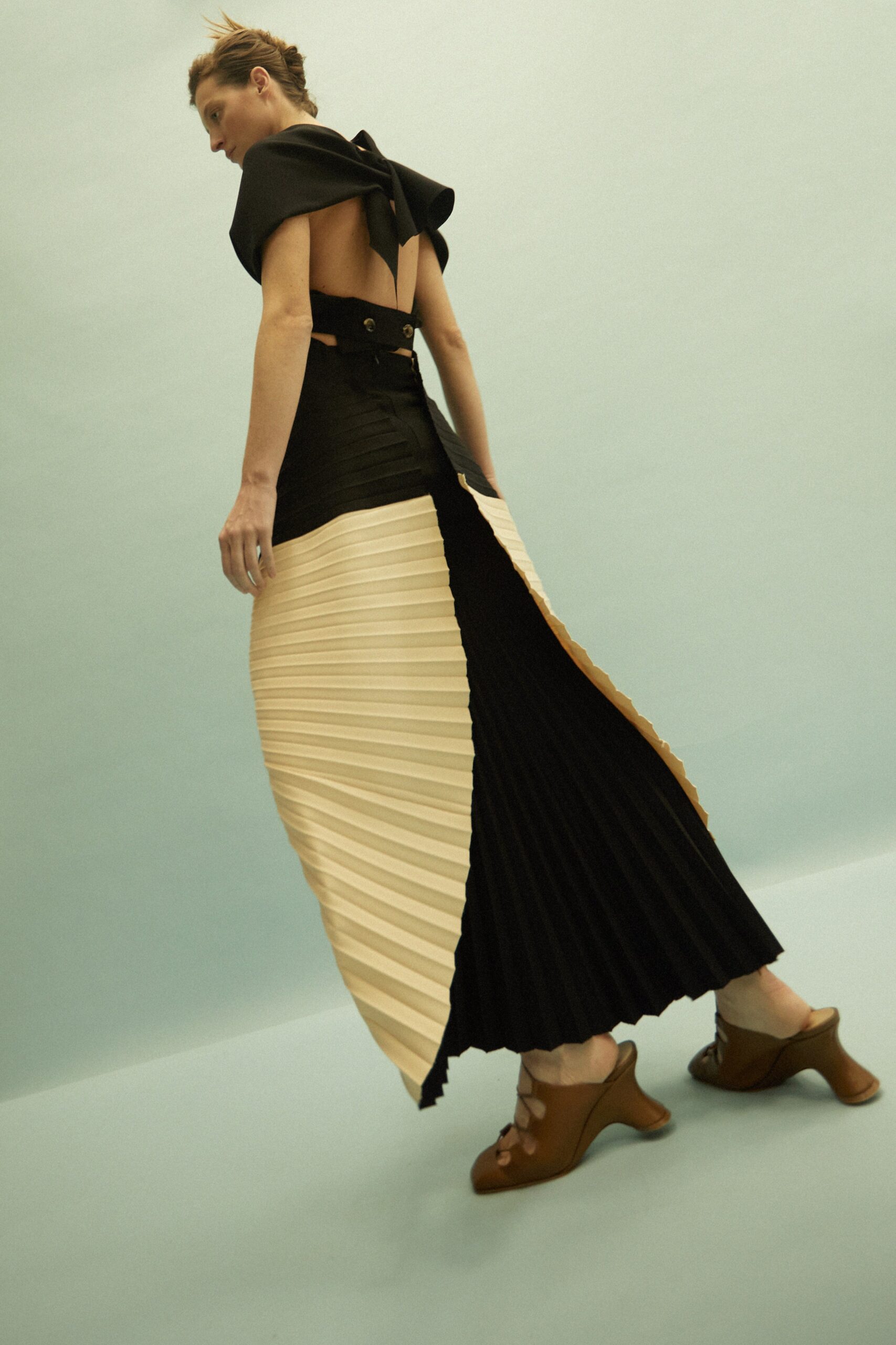 black and beige pleated dress