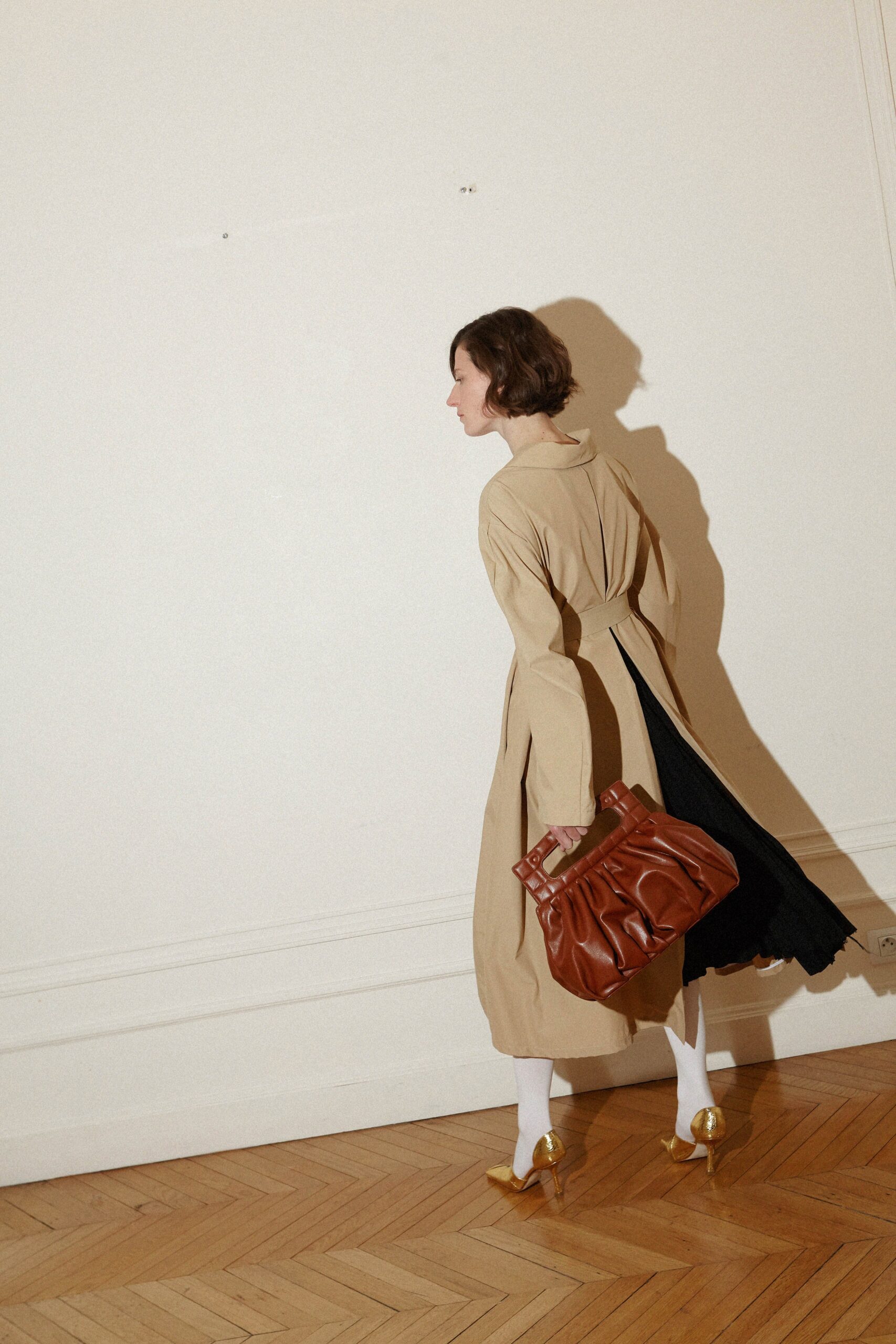 black midi dress with beige coat