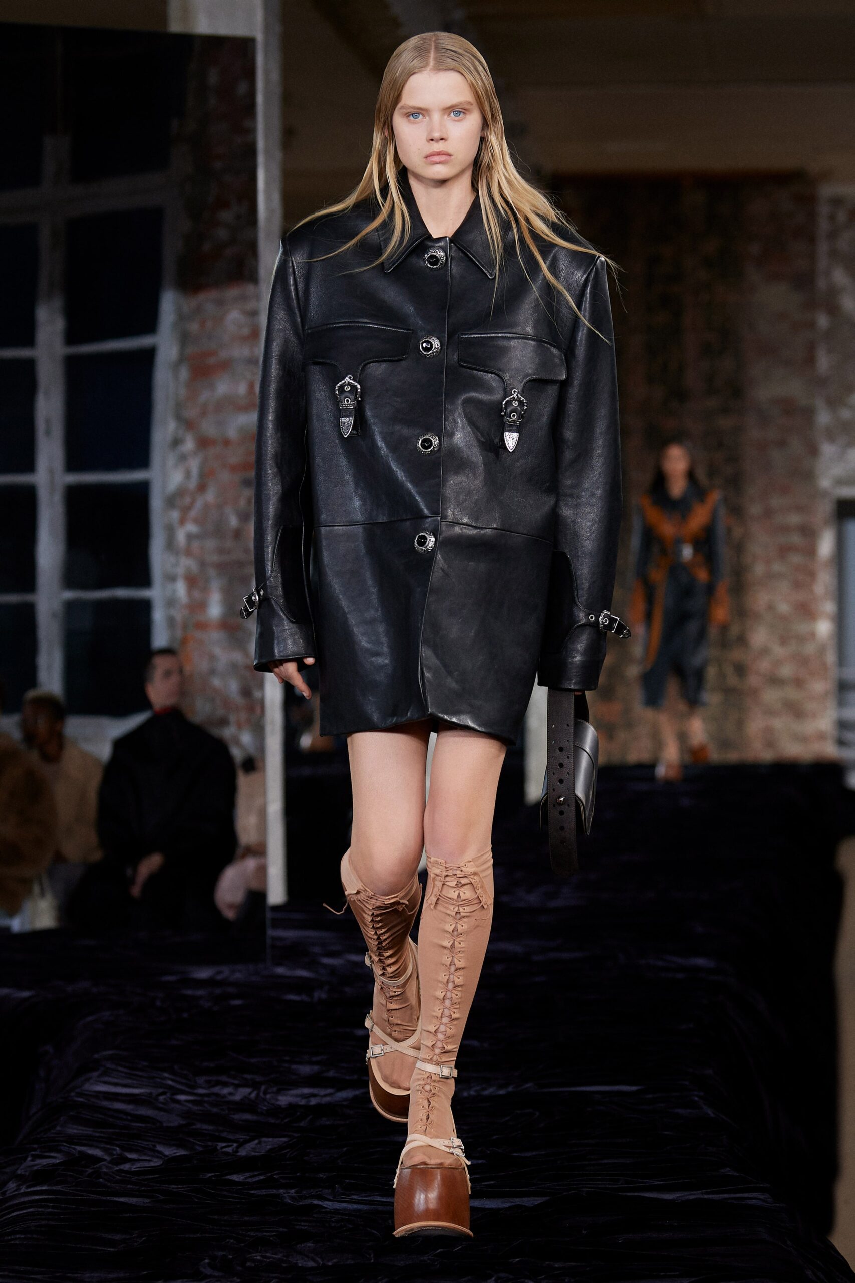 black leather coat with brown shoes